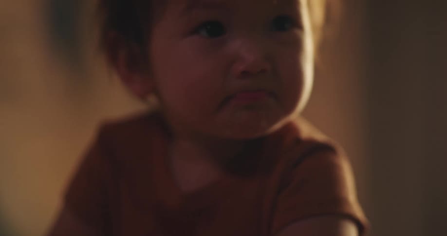 Baby in a crib with a happy facial expression