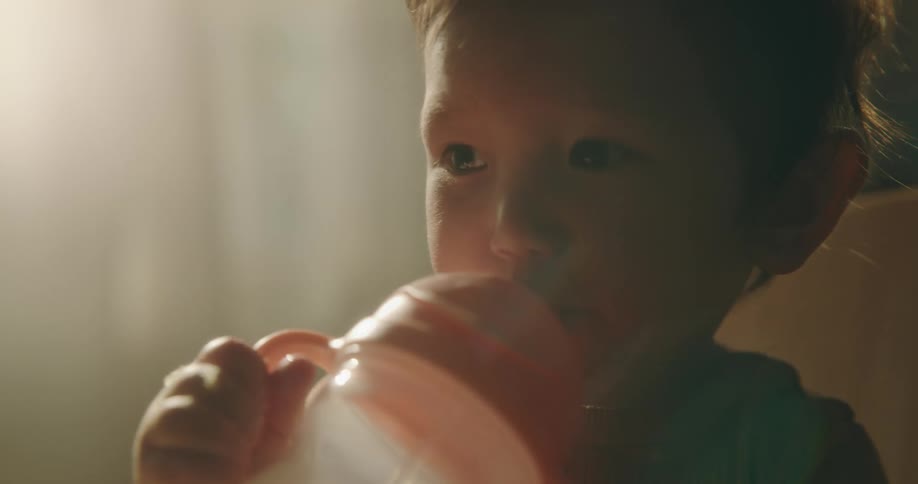 Baby drinking water from a bottle