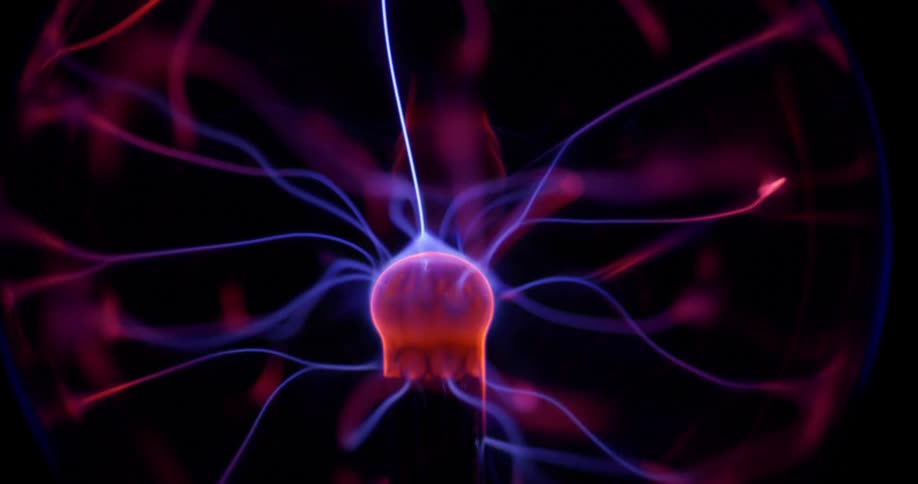 Glowing purple wisps extend into pink illuminated energy from a phosphorescent pink object