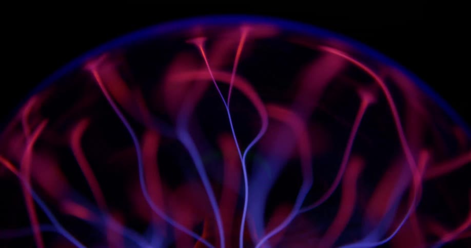 Closeup of a plasma ball with filaments extending between the inner and outer spheres