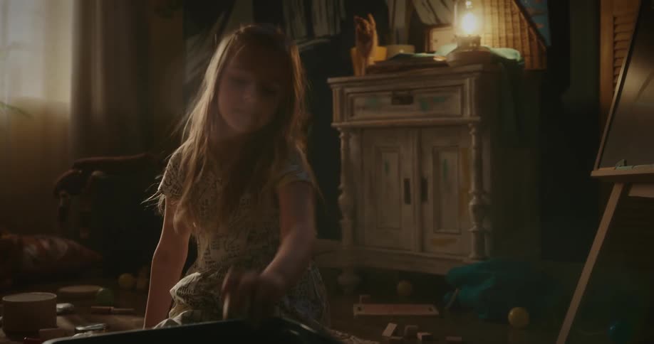 A girl is playing with her toys