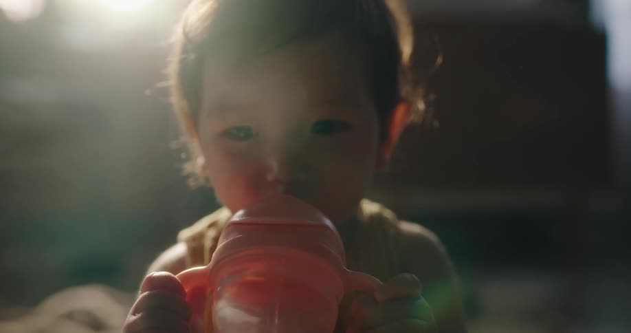 A happy baby clapping his hands