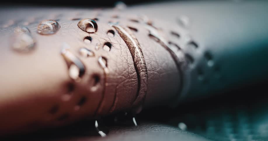 A drop of water runs on a surface that has a semicircular shape