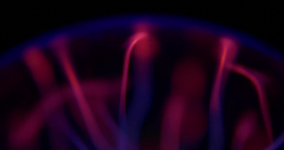 Lights forming abstract shockwaves on a black background