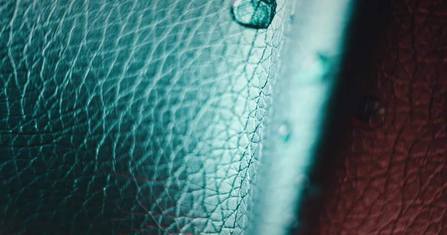 Extreme closeup of water droplets on leather