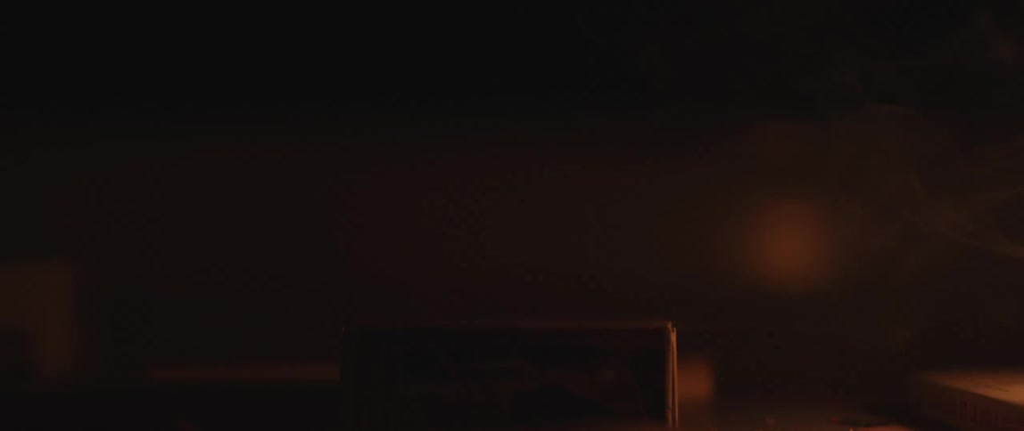 A person strikes a match