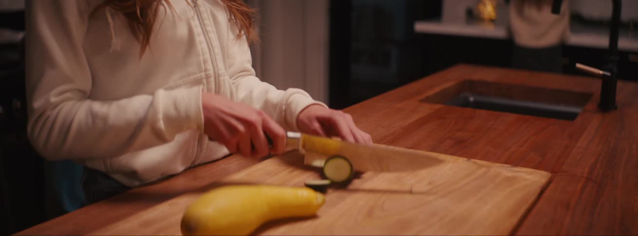 A family are preparing dinner at home