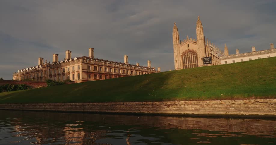 Panorama of a tourist spot featuring a view of a lake and a church in the background