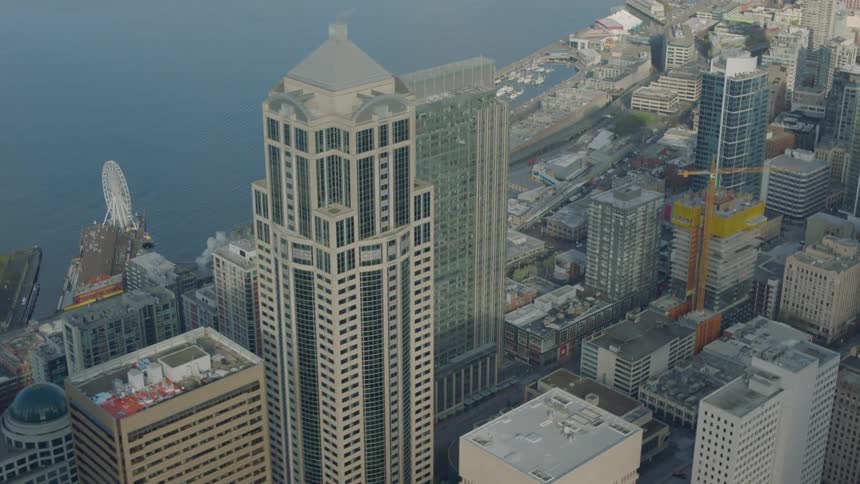 The tall buildings are near the coast line