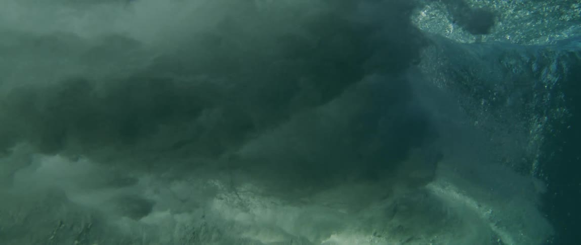 View from inside the sea of a powerful wave with bubbles