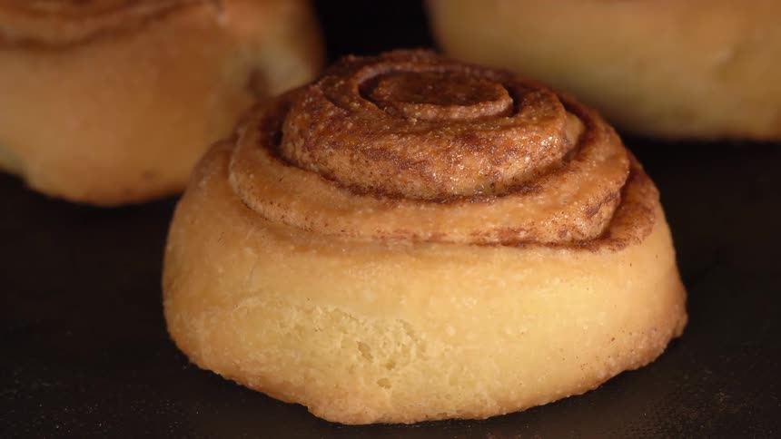 Small sweet pastries in slices being baked in the oven