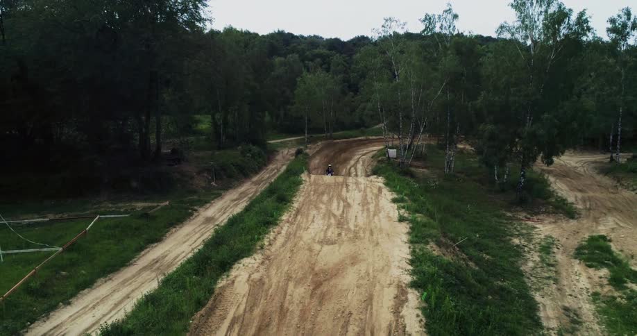 Motocross dirt bike jumping on a track