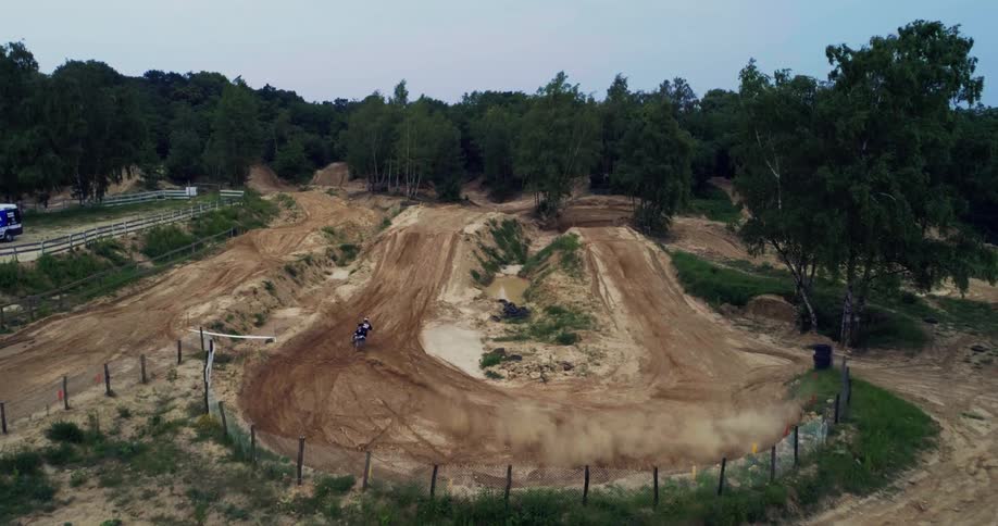 Aerial view motocross dirt track in forest