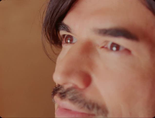 Portrait of a man observing a bright light and closing his eyes