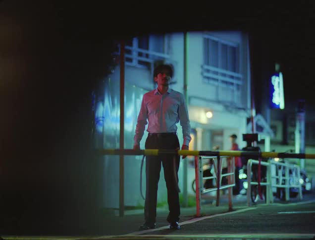 Man observing and waiting for the train to pass