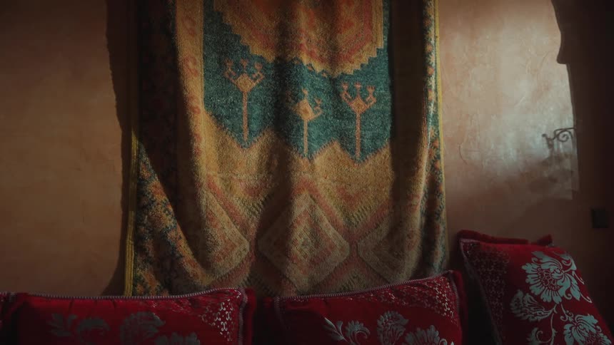 Door curtain and red throw pillows in a room