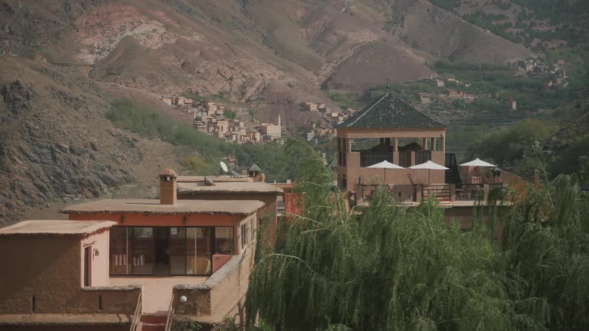 Houses sit near base of mountain slope