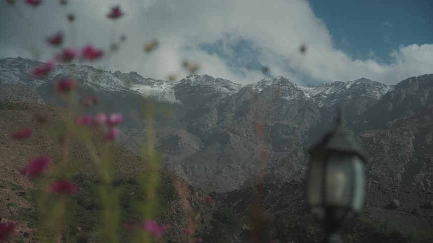 Panorama of snowcapped mountain peaks during the day