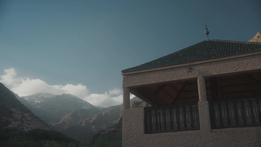 View of a house with mountains in the background