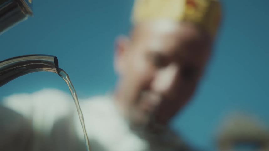 A person pouring water from a teapot