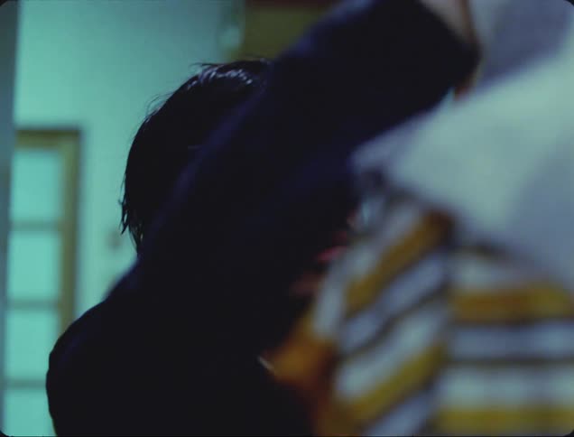 Father drying his sons hair in an irritated manner