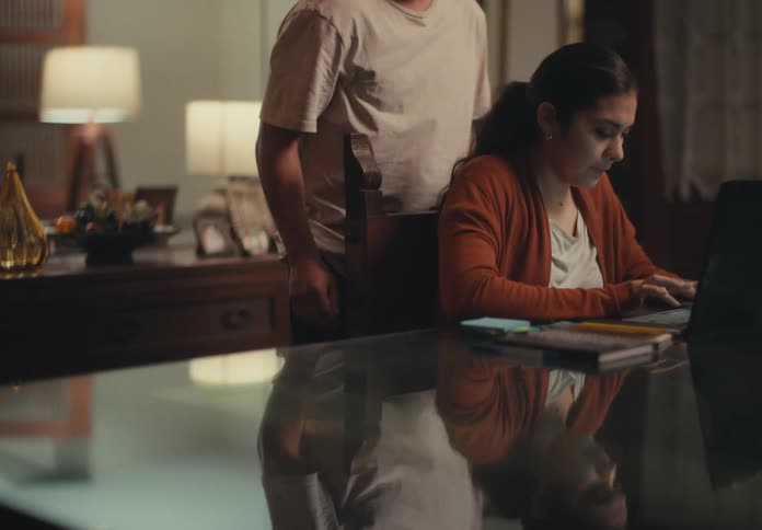 Woman working from home rejects the support of her partner