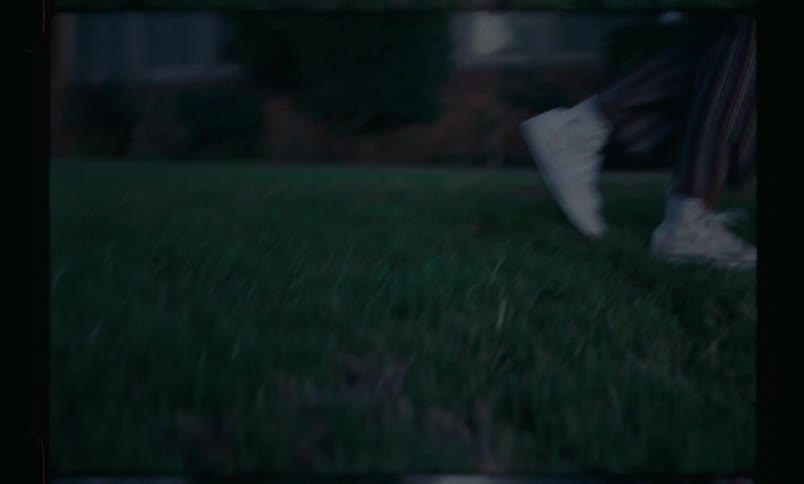 A person jumping over two others who are crouching and then crouches too