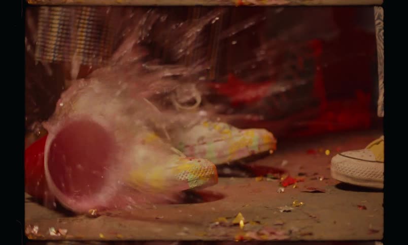 A person drops a cup and it spills all over