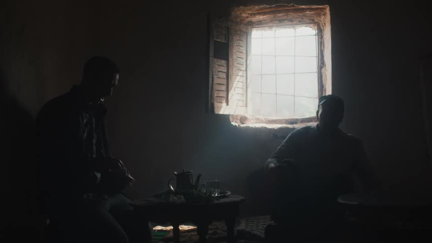 People entering a room with herbs and a kettle preparing a drink