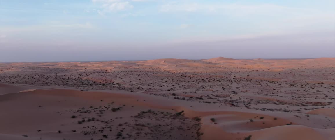 Shadows cover large portion of arid desert on cloudy day