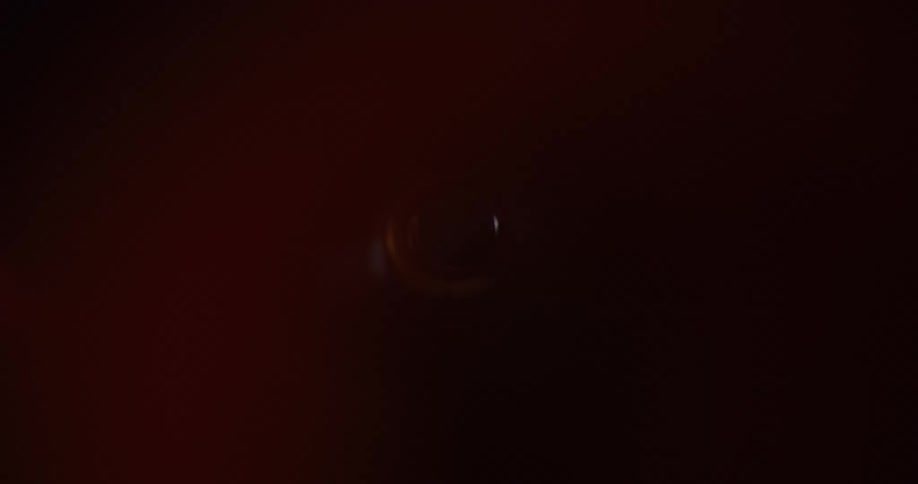 Inside an abstract narrow tube with external reflections of lights and shadows