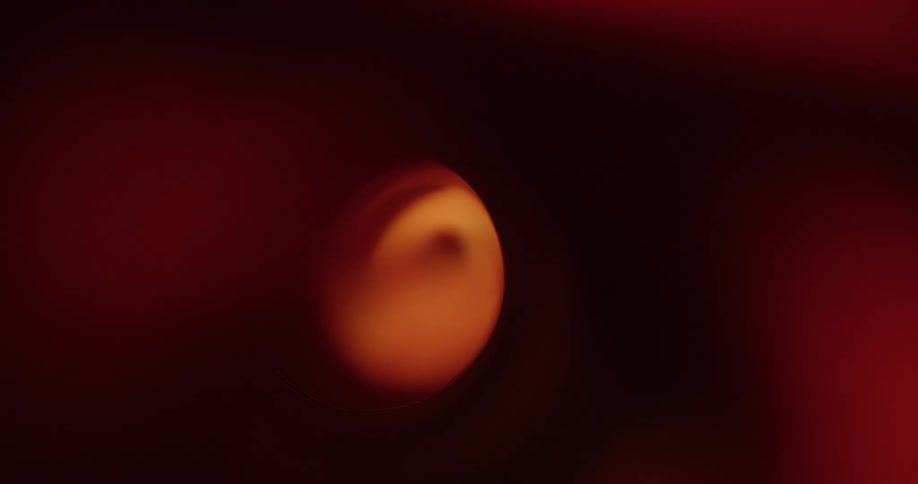 Light shining through a sphere in red