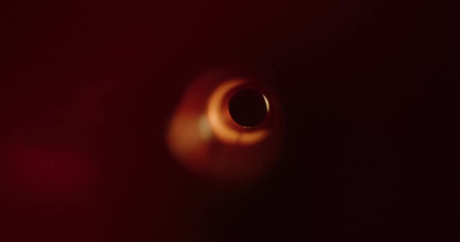 Inside an abstract and narrow tube with external reflections of lights