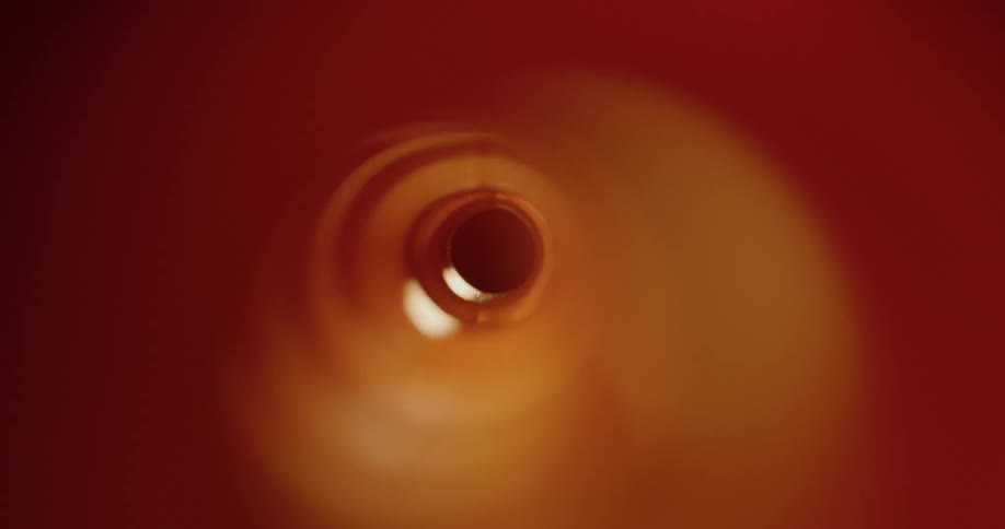 Light shinning in and out of a hole in the dark