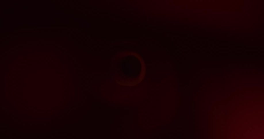 A light passing quickly through a tunnel with a hole at the end