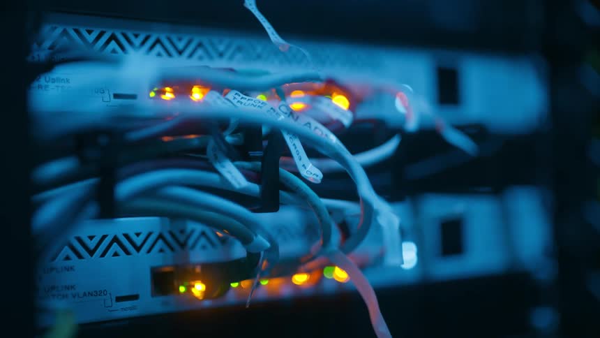 Closeup of network cables connected to white modems