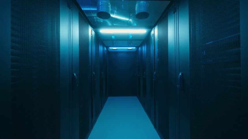 Slow dolly in into a server room.