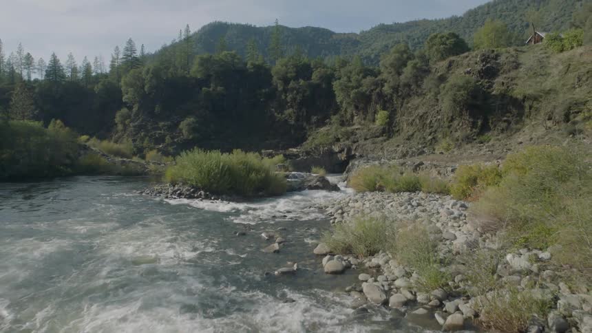 Pullback traverse over rapids and whitewater of a churning mountain river