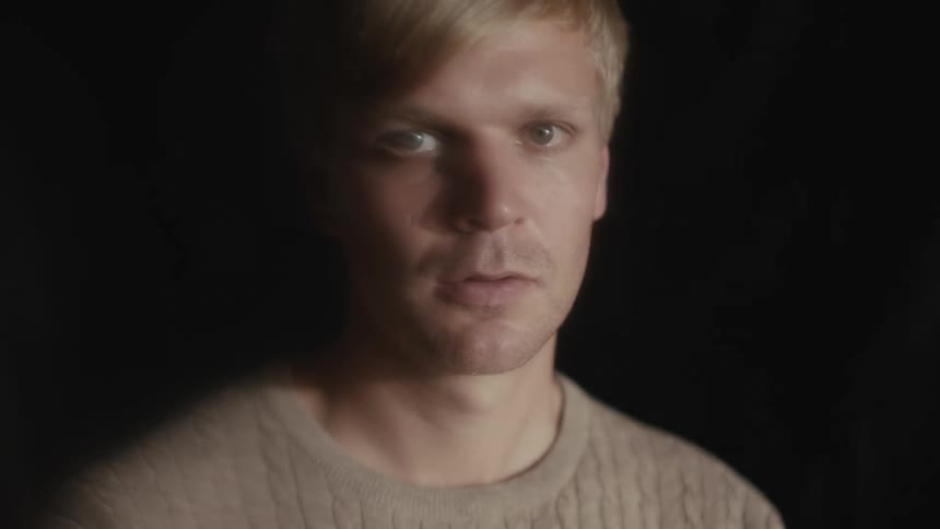 A close up facial of a male blonde