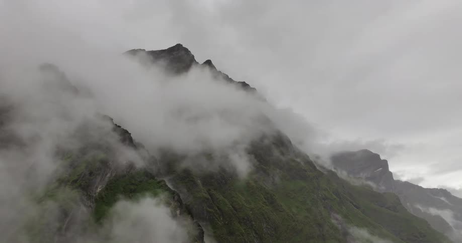 The clouds sit on the top of the mountains