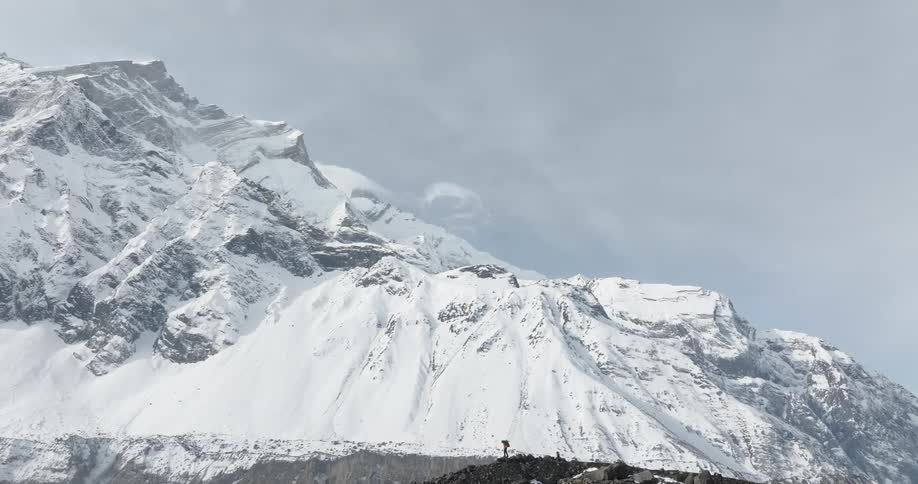 A person is hiking on the mountain top