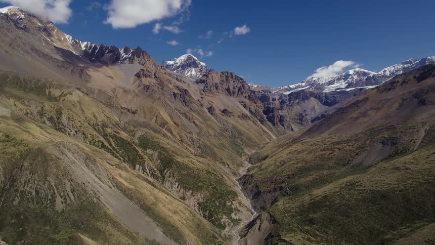 Aerial of valley between mountains during a sunny day