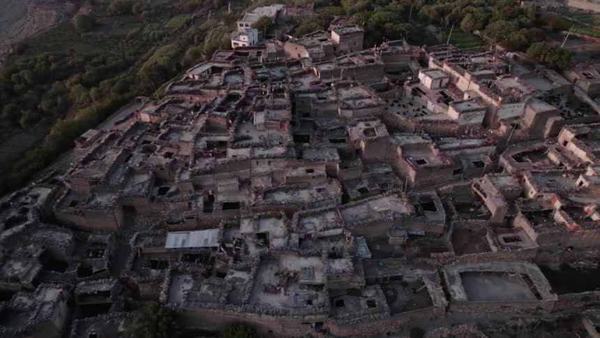 Aerial panorama of a village on a plateau surrounded by nature