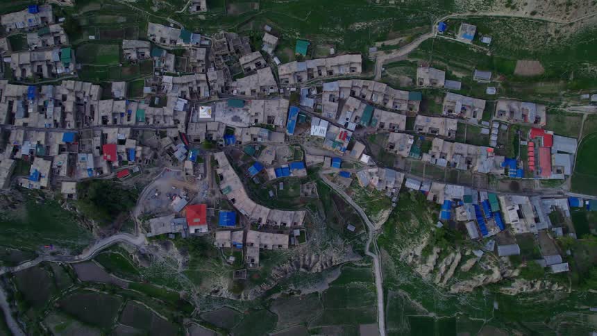 A city with different roof colors and road path