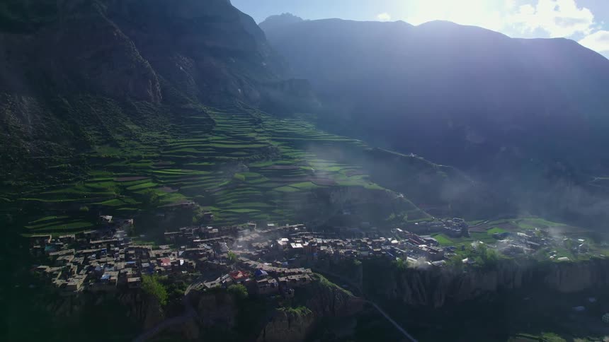 Aerial panorama of mountains with a village