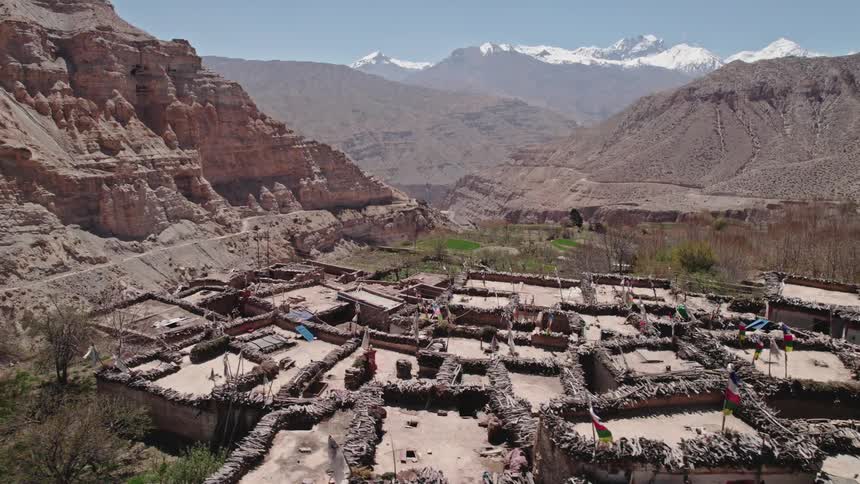 An aerial view of a rural community buildings in the desert