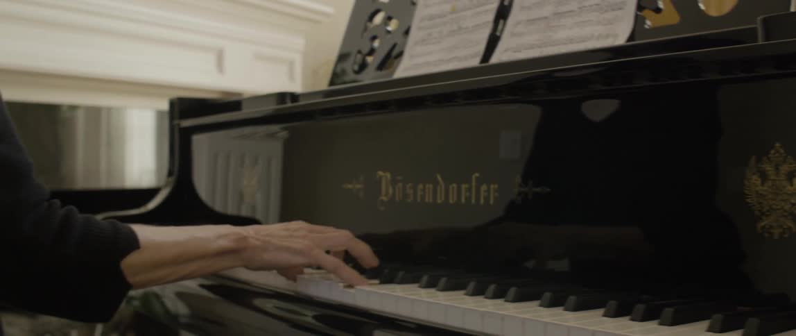 A woman is playing the piano
