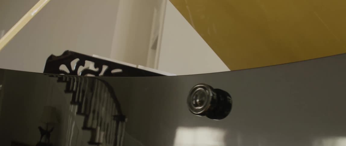 A large piano has a gold interior and reflecting coating outside