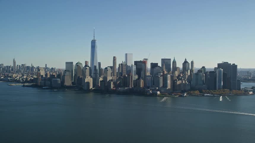 A city with tower block and skyscrapers close to the sea
