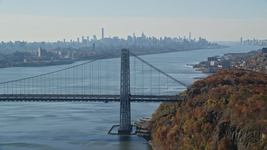 An aerial clip of a a bridge linking two metropolitan city costal line